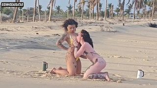 2 LEZBO HOES PLAYING ON THE BEACH THEY WERE CATCHED BY A TOURIST AND HAD THEIR BUM BANGED