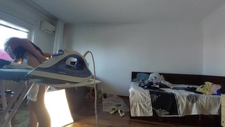 Amatuer mom does chores in the naked house.