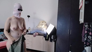 Amatuer ex-wife has fun trying on clothes and cutting them. Amateurs ex-wife dances naked around the house.